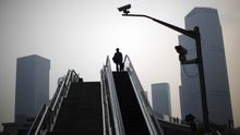 A man stands on an escalator at the financial district of Pudong in Shanghai May 6, 2011. China needs to keep the promises it made when it joined the World Trade Organization and change discriminatory industrial policies that give its own firms an unfair advantage, the top U.S. trade official said on Thursday.
REUTERS/Carlos Barria (CHINA - Tags: SOCIETY BUSINESS IMAGES OF THE DAY)