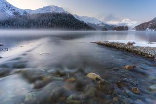 Engadin: Autumn sunrise on Lej Da Champfer with snow capped Piz Da La Margna and Piz Corvatsch in background, Engadine, canton of Graubunden, Switzerland, Europe