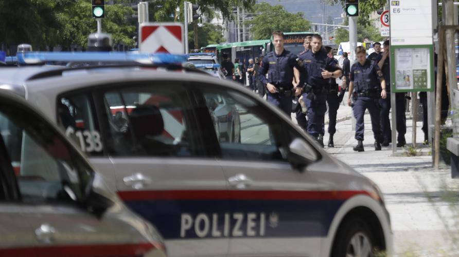 Graz: Police walk near a school where several people died in a shooting, on June 10, 2025 in Graz, southeastern Austria. Ten people died after a suspected shooter opened fire in a southeastern Austrian school, press agency APA quoted Graz city mayor Elke Kahr as saying. Several students and at least one adult are among those killed, Kahr confirmed to APA. (Photo by Alex HALADA / AFP) (Photo by ALEX HALADA/AFP via Getty Images)