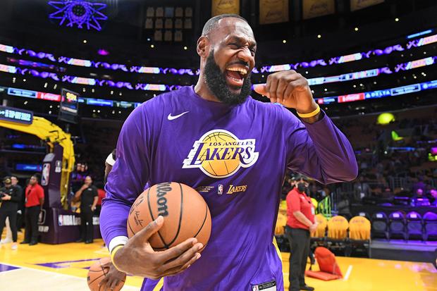LeBron James warms ‌up on court.