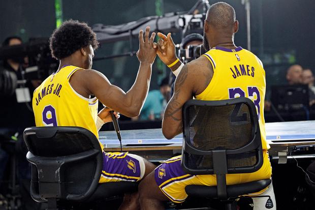 LeBron James and Bronny James on the bench