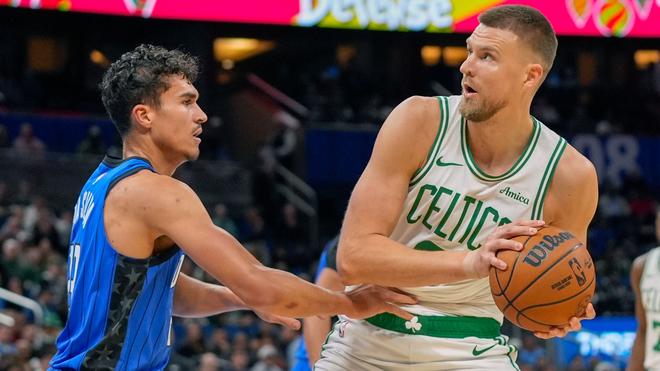 Orlando Magic players celebrate their remarkable victory.