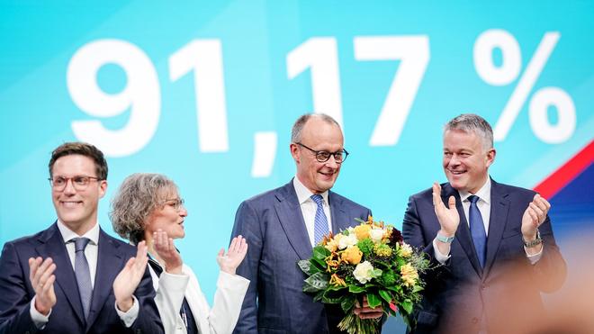 Photography: Ina Scharrenbach, chair of the meeting, Gordon Schnieder (r), top candidate of the CDU in Rhineland-Palatinate, and Manuel Hagel (l), top candidate of the CDU in Baden-Württemberg, congratulate Chancellor Friedrich Merz, CDU party leader, on his election as federal chairman.