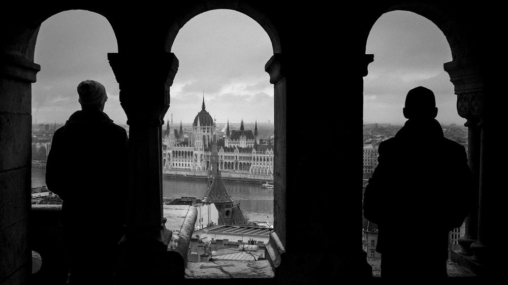 European Union: People look out over The Hungarian Parliament Building in Budapest.