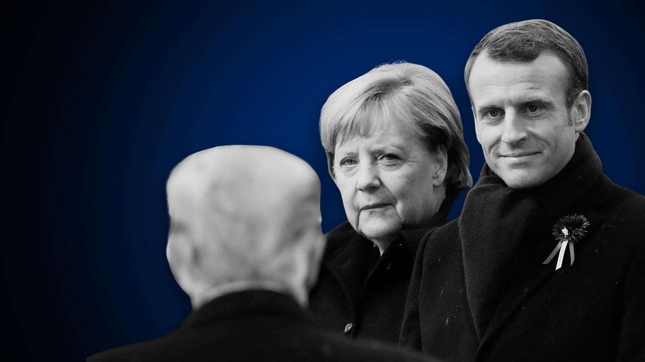 Folge 16: April 2018: TOPSHOT - German Chancellor Angela Merkel (C) and French President Emmanuel Macron (R) react as US President Donald Trump (front L) arrives to attend a ceremony at the Arc de Triomphe in Paris on November 11, 2018 as part of commemorations marking the 100th anniversary of the 11 November 1918 armistice, ending World War I. (Photo by BENOIT TESSIER / POOL / AFP) (Photo by BENOIT TESSIER/POOL/AFP via Getty Images)