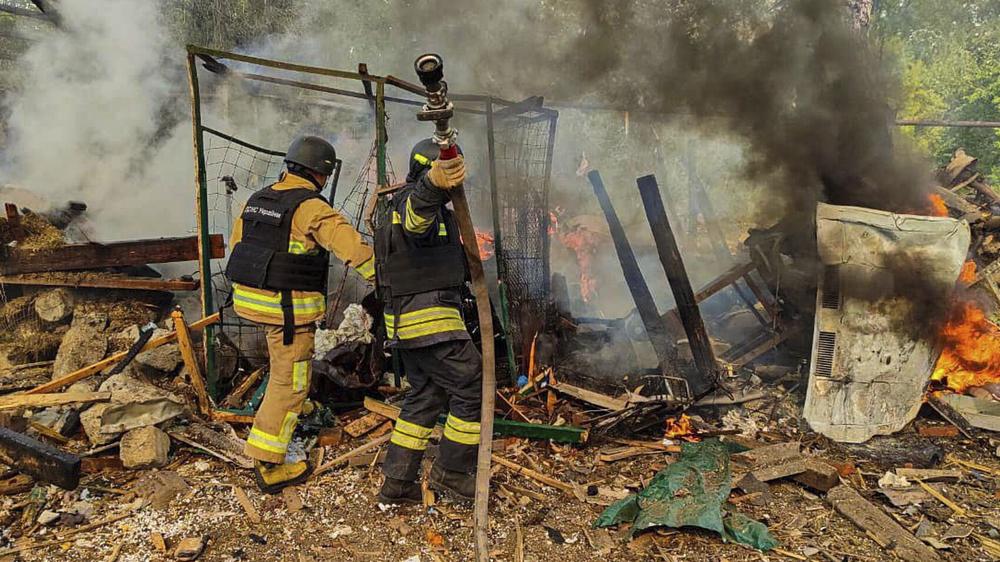  Ukrainische Feuerwehrleute in der grenznahen Stadt Bilopillja in der Region Sumy