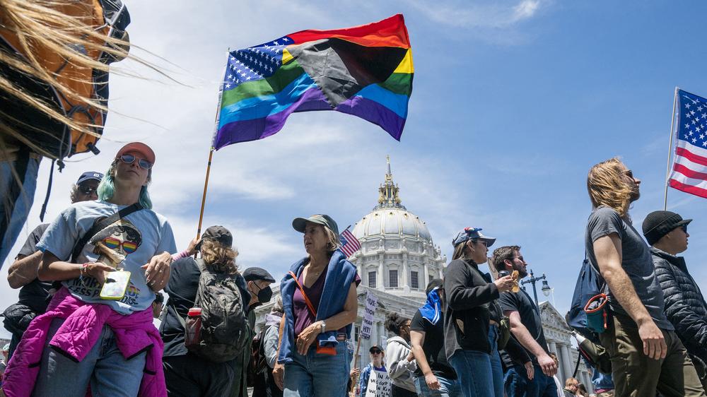  People gather at city hall to protest the Trump administration during the "No Kings" national rally in San Francisco on June 14, 2025, on the same day as President Trump's military parade in Washington, DC. Tens of thousands of protesters rallied nationwide Saturday against Donald Trump ahead of a huge military parade on the US president's 79th birthday -- as the killing of a Democratic lawmaker underscored the deep divisions in American politics. "No Kings" demonstrators took to the streets in New York, Los Angeles, Chicago, Philadelphia, Houston, Atlanta and hundreds of other cities across the United States to condemn what they call Trump's dictatorial overreach.