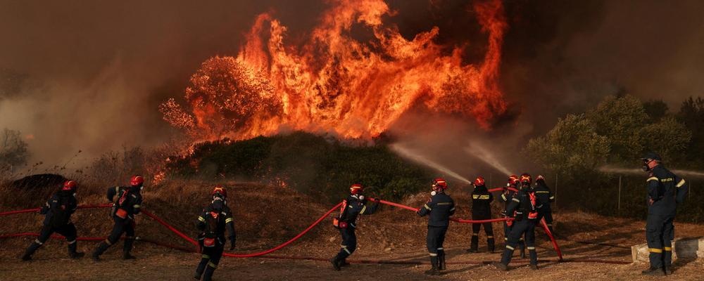 Firefighters work on a burning area near Loumpa, as wildfires hit West Attica, Greece, August 3, 2026. REUTERS/Louisa Gouliamaki     TPX IMAGES OF THE DAY