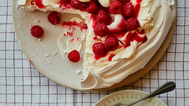 Pavlova with Raspberries, Lychees, and Elderflower Cream: A Light and Airy Summer Delight